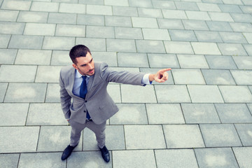 young smiling businessman outdoors from top