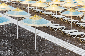 parasol and sun lounger on the beach