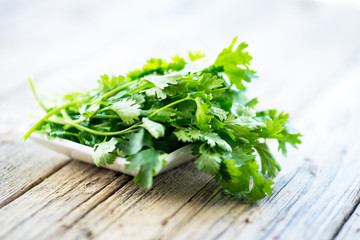 fresh parsley on wooden table