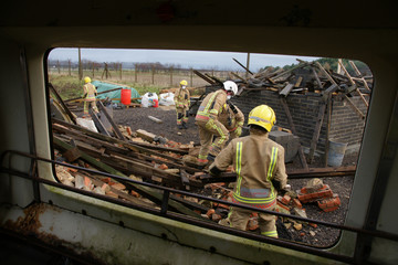 Fototapeta premium fire-fighters at building collapse disastor