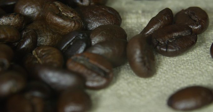 Brown coffee beans, close-up of coffee beans for background and texture.