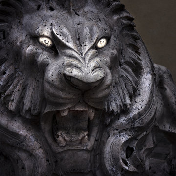 Closeup of lion's head with enlightened eyes - concept image