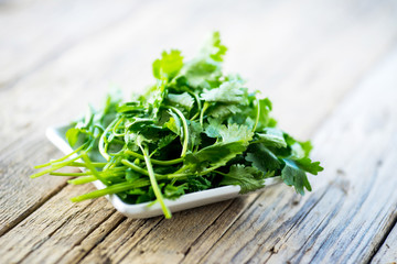 fresh parsley on wooden table
