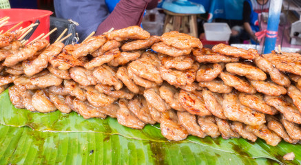 Street food traditional thai style grilled pork.