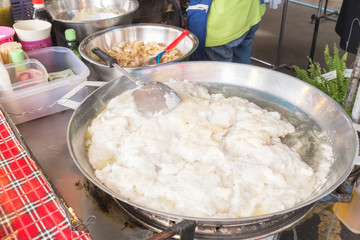 Thailand street food stir-fried squid eggs on the pan.