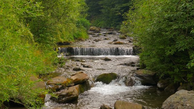 4k,
Waterfall in the mountains near the village Pylypets, Carpathians