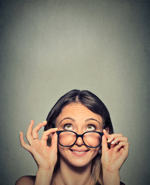 Smiling Woman Wearing Eyeglasses with Black Frames Looking Up