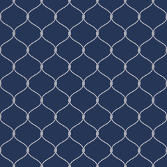 Naklejka premium Nautical rope seamless fishnet pattern on dark blue background