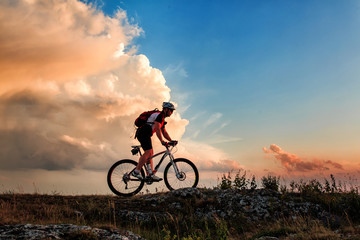 Fototapeta na wymiar Biker riding on bicycle in mountains
