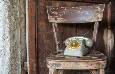 Vintage phone on a old chair