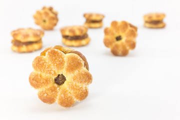 Biscuit with pineapple jam on white background.