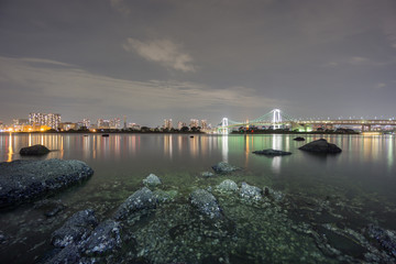 Fototapeta na wymiar Long exposure of bay and Rainbow bridge from Odaiba, Nightview