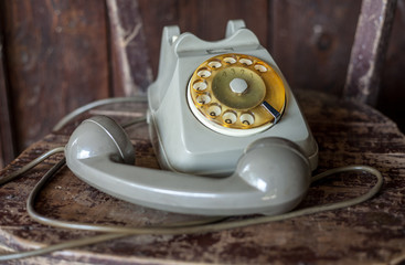 Vintage phone on a old chair