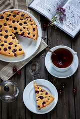 Cherry pie on old grey wooden background.