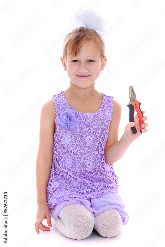 Poster little girl holding a pair of pliers