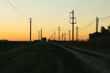 Fototapeta na wymiar Electricity on the street at sunset