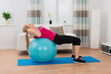 Woman Exercising With Fitness Ball