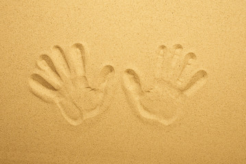 Handprint in the sand. Top view.