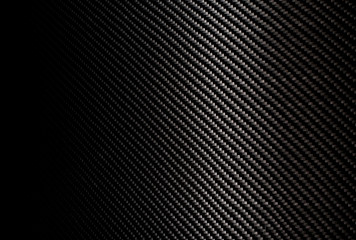 Woven carbon fiber sheet. Texture.
