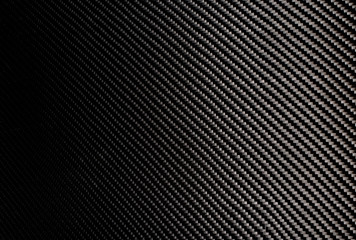 Woven carbon fiber sheet. Texture.