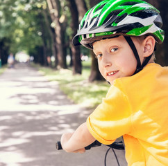 Boy in safe bicycle helmet close up portrait