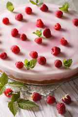 Beautiful food: raspberry cheesecake with mint vertical
