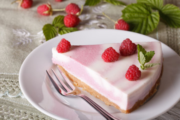 piece of raspberry cheesecake close-up on a plate. horizontal
