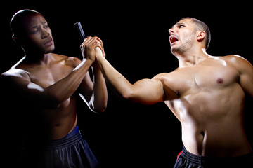 Martial artist disarming a criminal with a gun or close quarter combat
