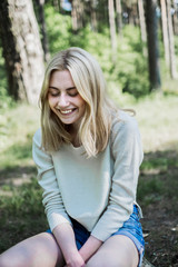 Obraz premium portrait of a beautiful young blonde in the forest, summer mood