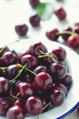 sweet cherry on a plate on wooden table