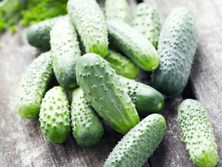 fresh cucumbers on wooden table