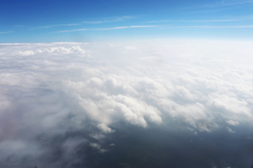 Fototapeta na wymiar Aerial cloudscape sky in stratosphere shot from airplane window