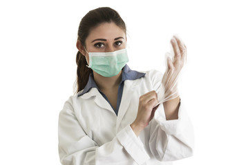 Young female doctor wearing gloves and mask