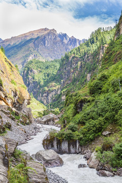 River coming through a valley, Annapurnas area, Himalayas, Nepal