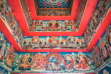 Buddhist gateway with painted ceiling and walls