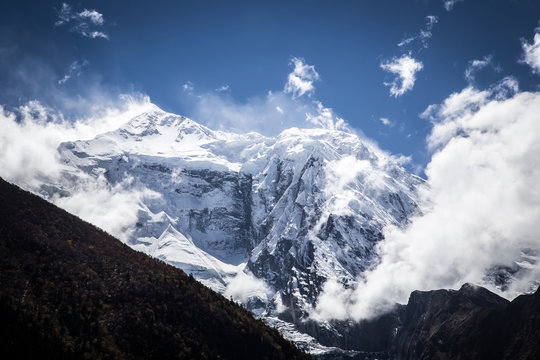 Snowy mountain peak and clouds, Himalaya, Nepal
