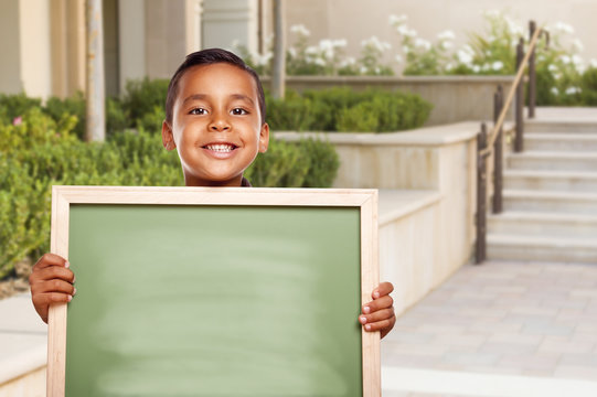 boy at blank chalkboard