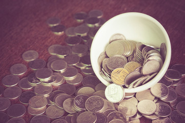 Coin in the cup with filter effect retro vintage style