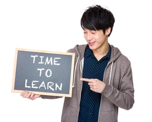 Young man finger point to chalkboard showing the phrases of time