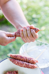 chef making kebabs