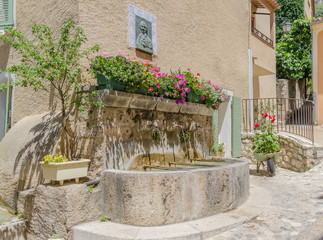 Water fountain in Moustiers-Sainte-Marie in Provence, France