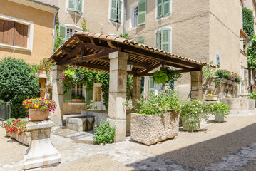 Fototapeta na wymiar Water fountain in Moustiers-Sainte-Marie in Provence, France