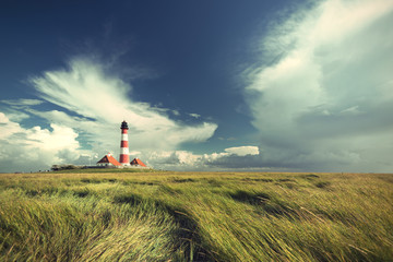 famous Westerhever lighthouse at North Sea coast, Schleswig-Holstein, Germany, Europe, vintage filtered style