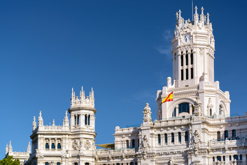 Fototapeta na wymiar Clock tower of the Cybele Palace (Palacio de Cibeles) in Madrid
