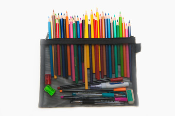 colorful of crayon wood in black bag