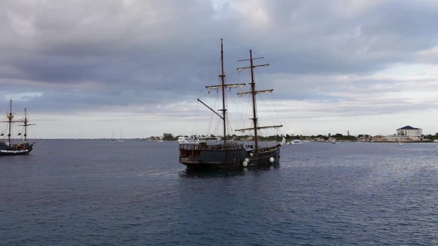 Old wooden frigates are tendered at Grand Cayman Island. Caribbean Sea