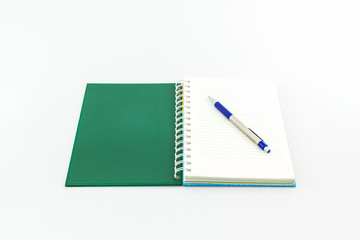 Open green book with pen.