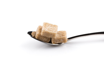 Cubes of sugar on a spoon
