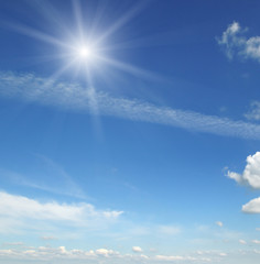 Naklejka na ściany i meble sun on blue sky with white clouds