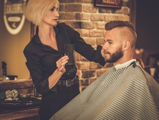 Client visiting hairstylist in barber shop
